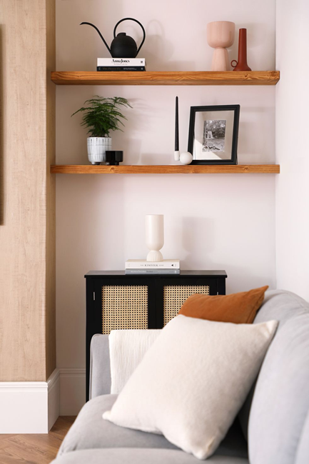 how-to-make-a-small-living-room-look-bigger-by-using-and-styling-shelves-vertically