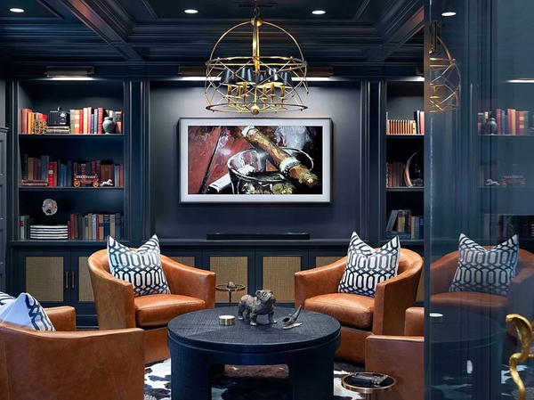 a-man-cave-room-with-bold-floor-to-ceiling-bookshelves